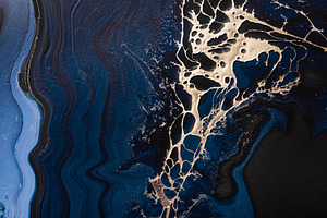 Acrylic Fluid Art. Liquid gold spill on dark blue waves of abstract ocean. Marb, a Photo by colnihko