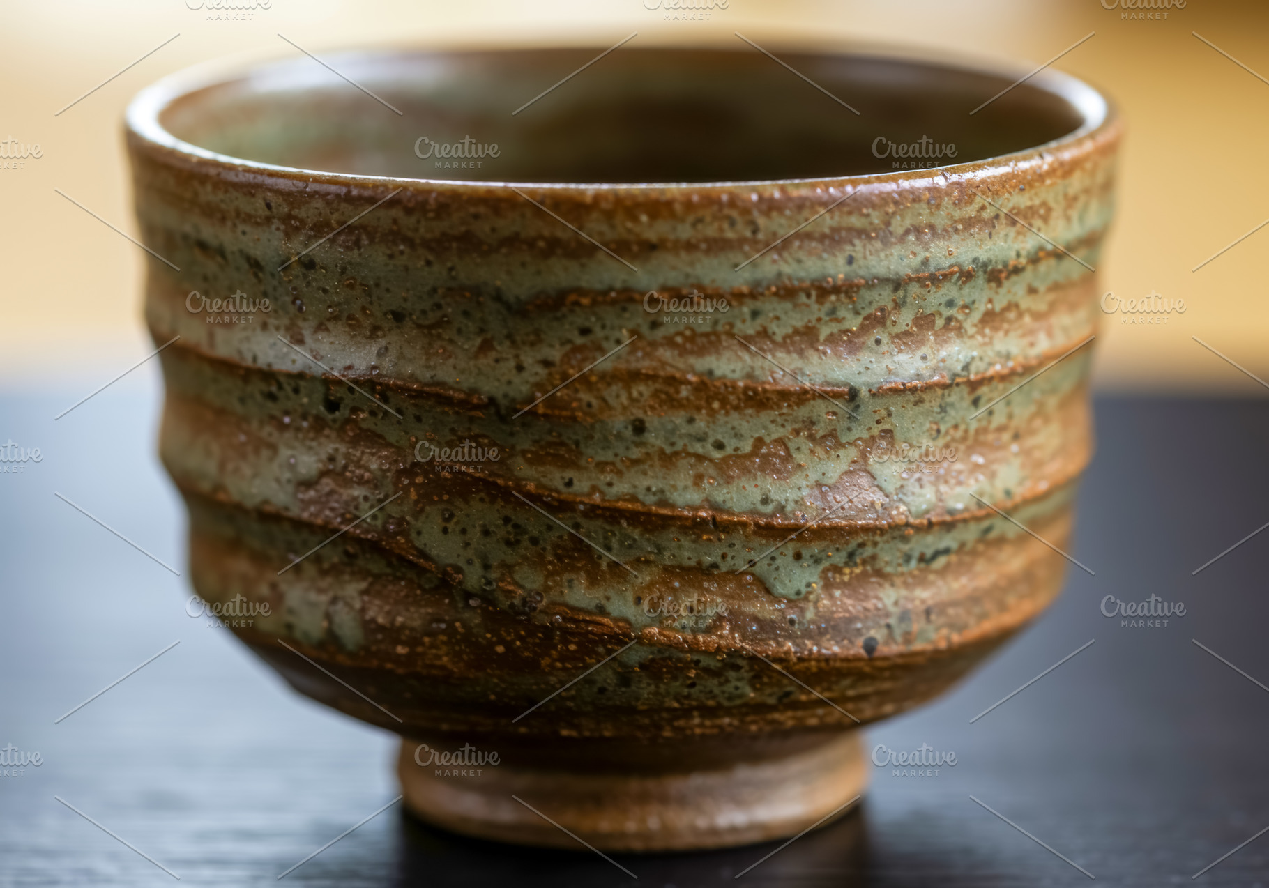 Handmade ceramic tea bowl with earth, a Food & Drink Photo by professorinc