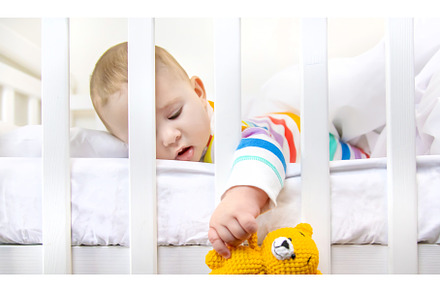 The baby in the crib goes to bed, a Person Photo by yanadjana