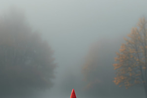 Single red marker on wooden path in fog, concept of focus, prior, an Abstract Photo by José Manuel Gelpi