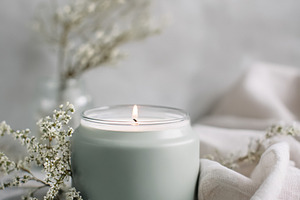 Lit candle creating a relaxing and tranquil atmosphere for aroma, a Photo by Studio ANNA