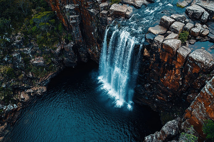 Majestic waterfall cascading into de, a Photo by Iftikhar Alam