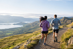 Running on scenic trail with mountai, a Photo by Dvoevnore photos