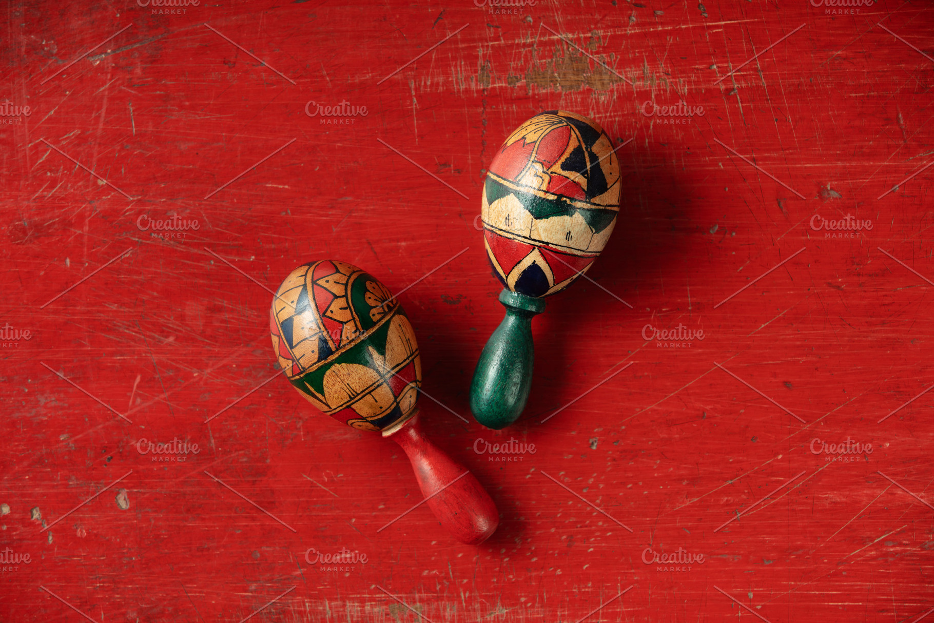 Couple of maracas on vintage red background top view, an Arts & Entertainment Photo by Natalia Klenova's Shop