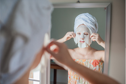 Young red-haired woman doing facial, a Beauty & Fashion Photo by Elizaveta Galitskaya