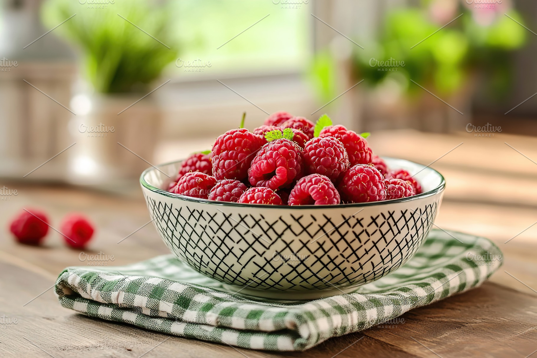 Fresh ripe red raspberries displayed in a ceramic bowl on a checkered napkin, a Food & Drink Photo by AlyaAnd