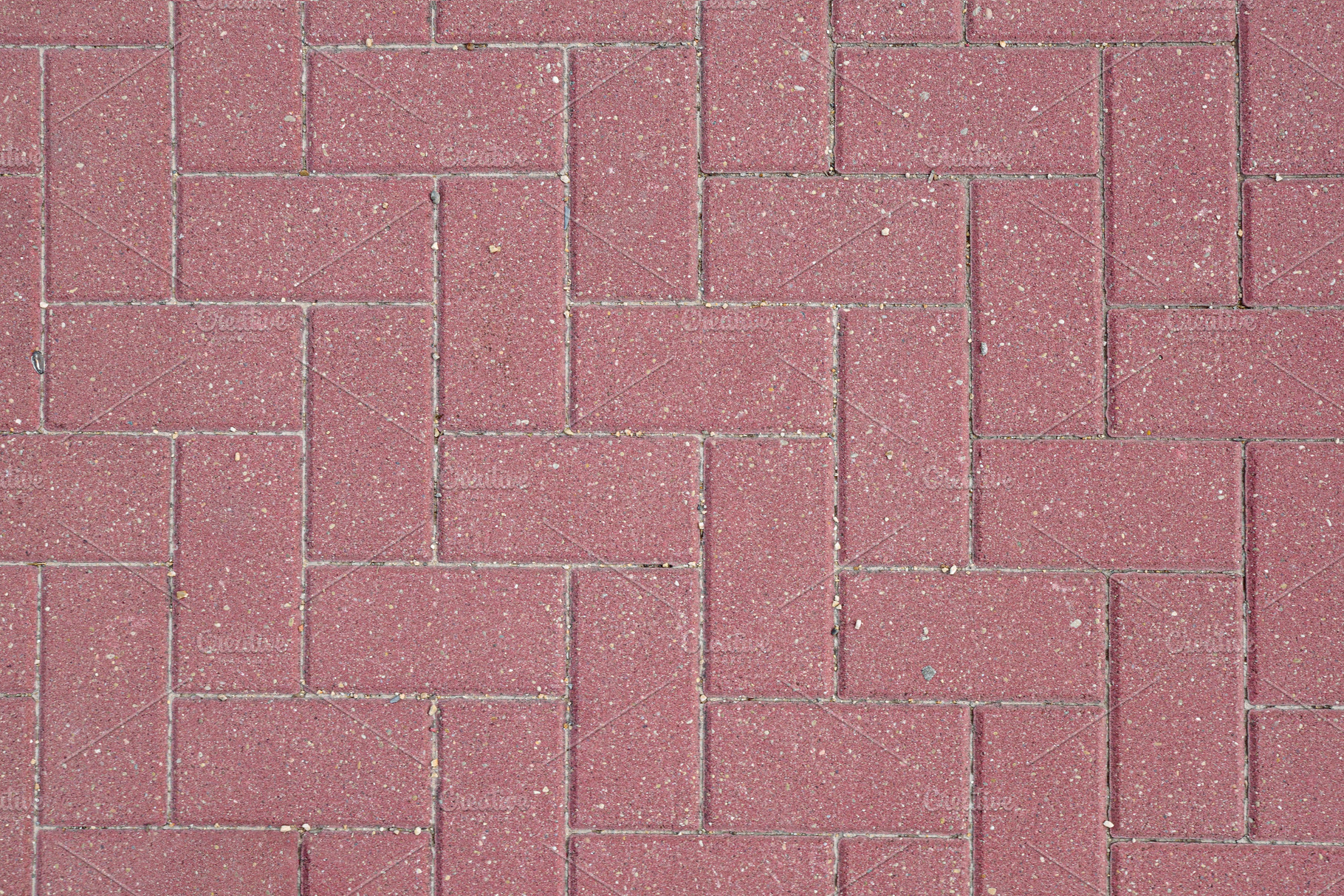 Detail of reddish outdoor paving laid with a stylish pattern, a Background Photo by Davizro's Market