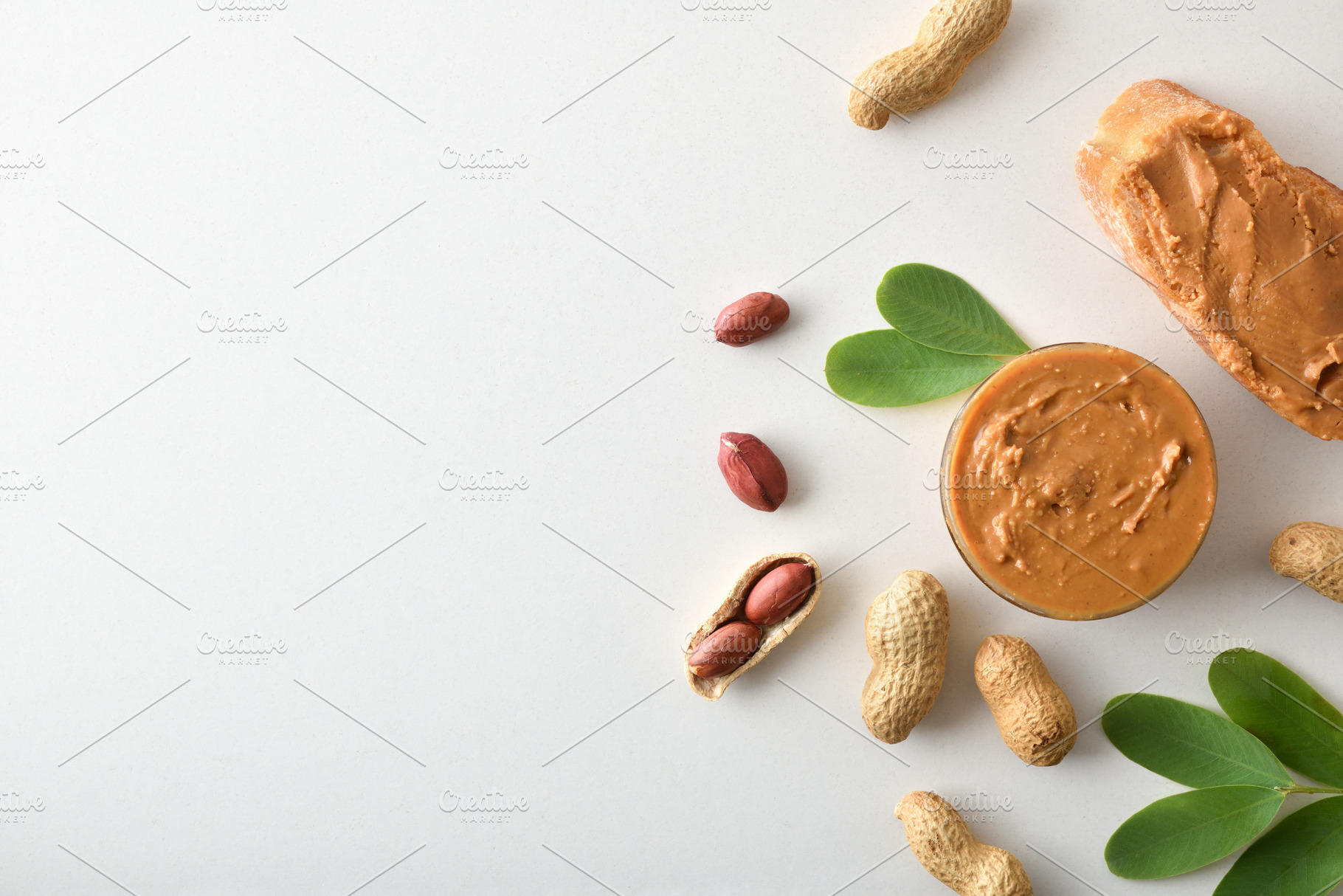 Peanut butter and slices of bread on a white table, a Food & Drink Photo by Davizro's Market
