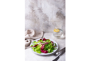Bowl of fresh green salad mix, a Food & Drink Photo by Yulia Furman