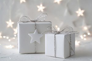 Silver-tied white gifts, a Photo by Beautiful things