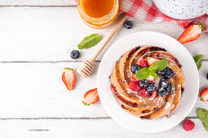 Sweet summer bundt cake with fresh fruit and berry, a Food & Drink Photo by Rimma