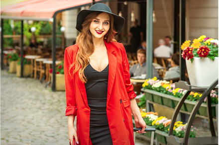 Woman is posing in the city street, a Person Photo by okskukuruza
