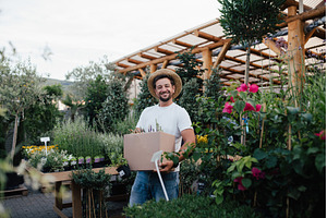 Customer carrying flower box at, a Person Photo by HalfPoint