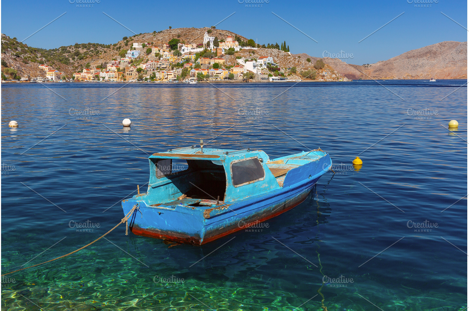 Small Boat in Harbor of Symi, Greece, a Nature Photo by kavalenkava
