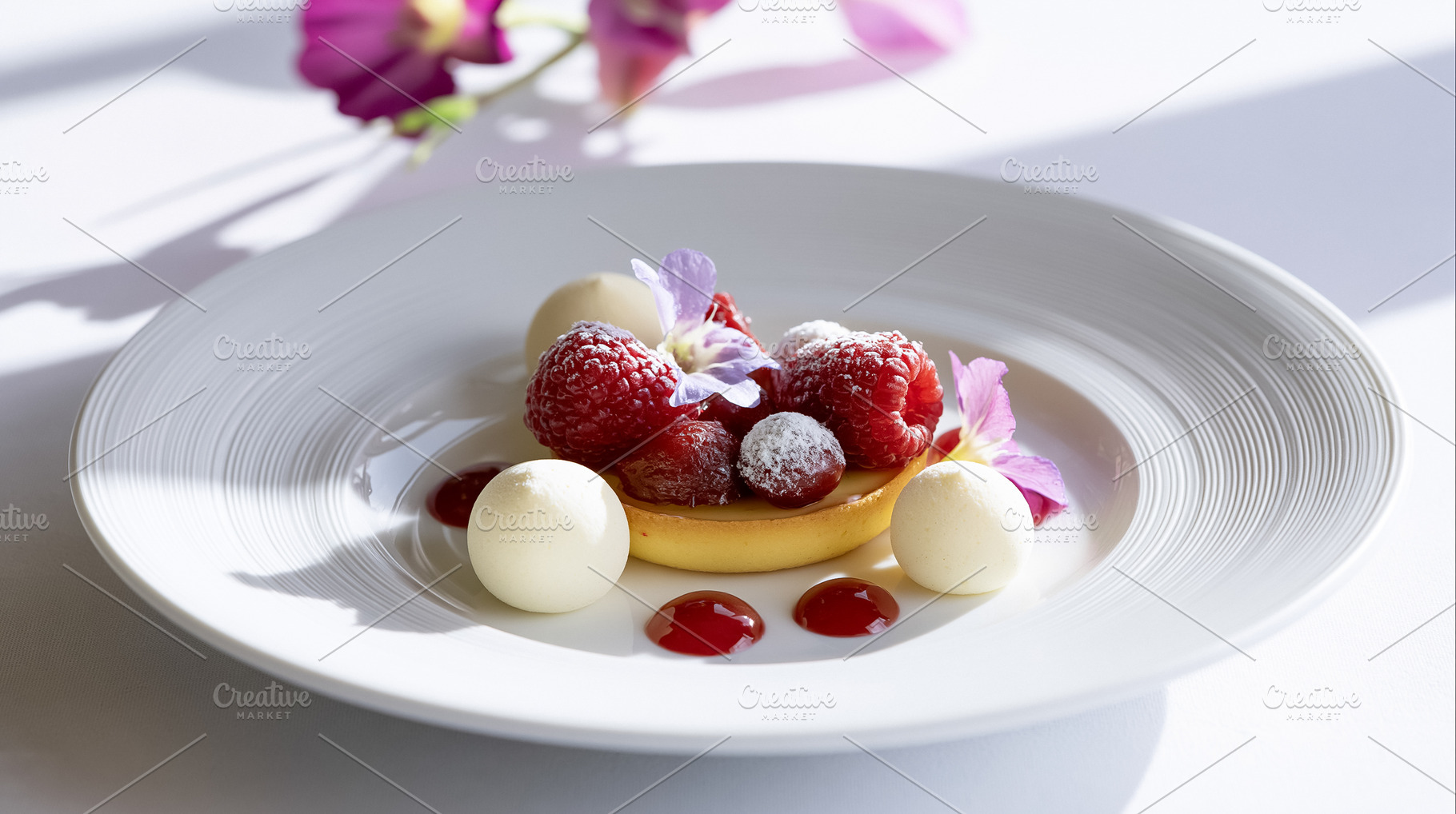 Gourmet raspberry tart featuring fresh raspberries, white chocolate spheres, be, a Photo by Studio ANNA