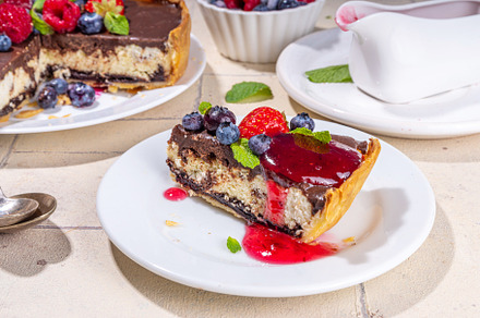 Homemade cheesecake with chocolate and berry, a Food & Drink Photo by Rimma
