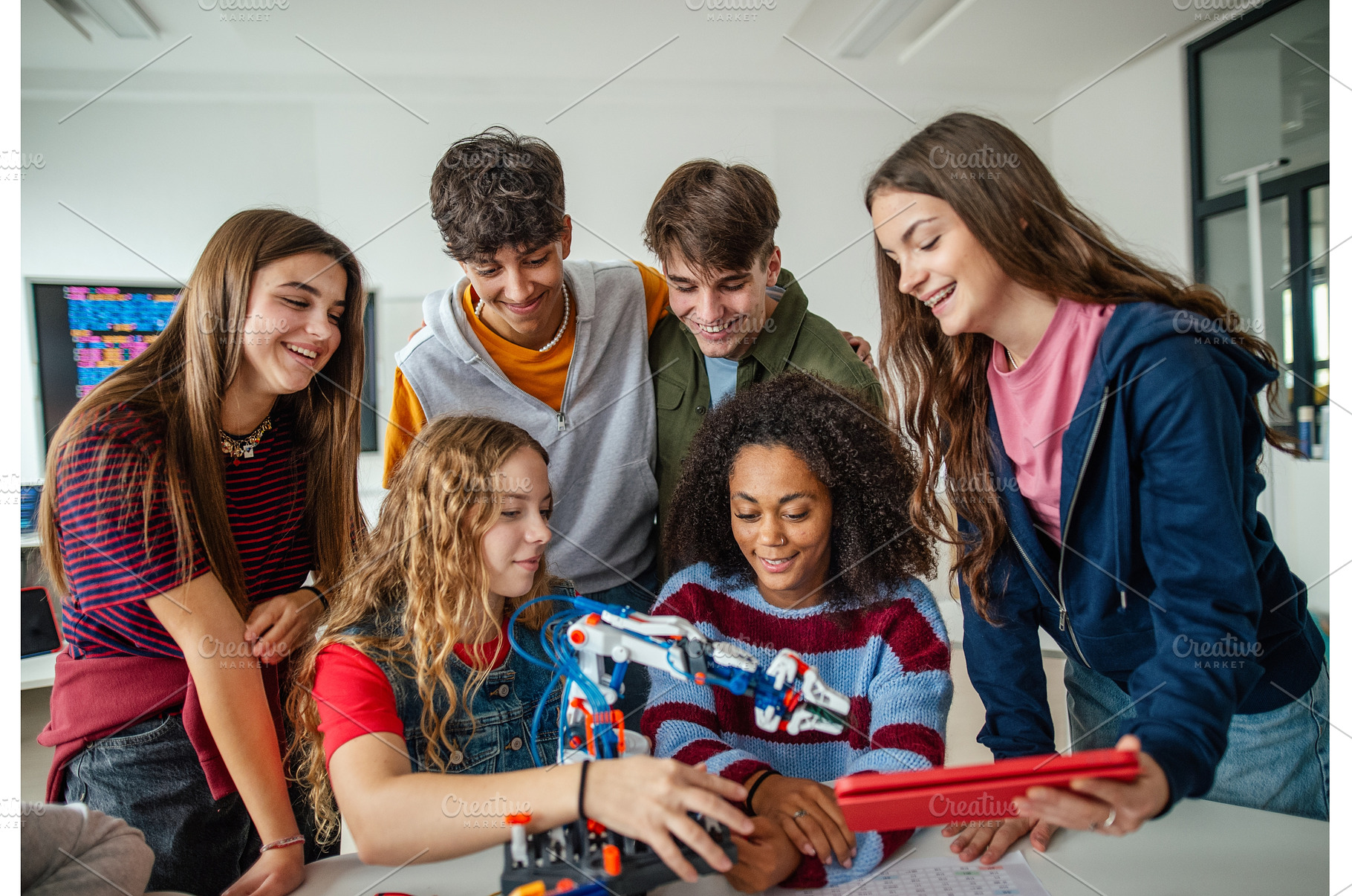 Group of high school students, a Technology Photo by HalfPoint