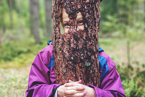 Funny girl with a piece of tree bark, a Person Photo by BOOCYS