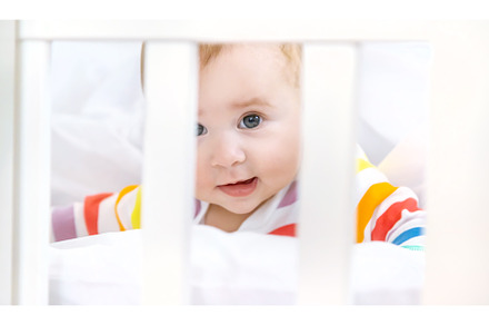 The baby in the crib goes to bed, a Person Photo by yanadjana