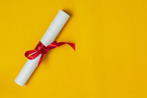 Top view graduation background containing single, award, and certificate