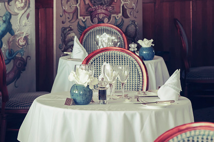 table in stylish restaurant, uk, a Food & Drink Photo by ariadna de raadt