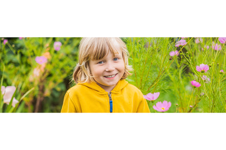 Boy enjoying pink flowers in the, a Nature Photo by Elizaveta Galitskaya