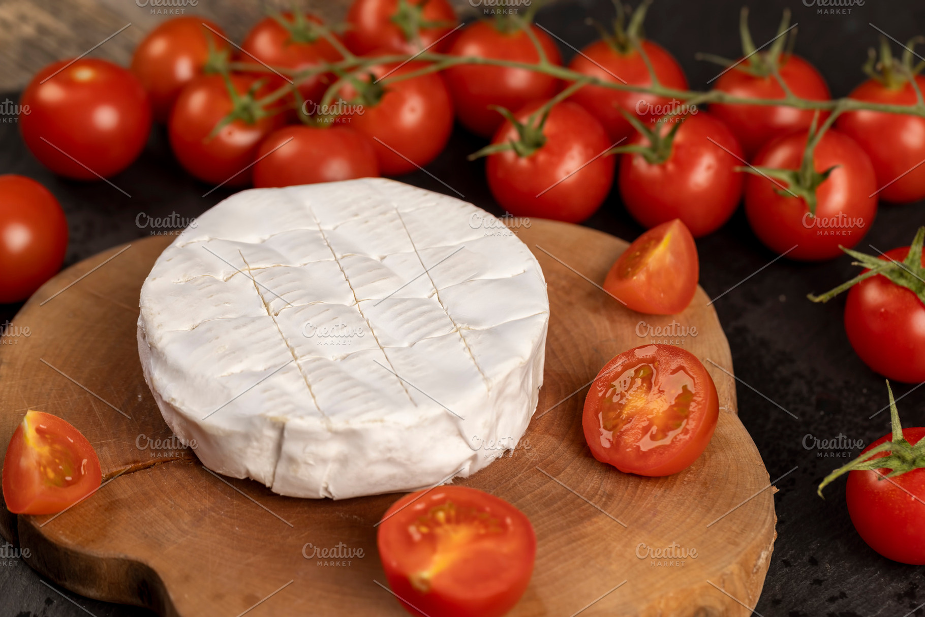 soft cheese with mold and ripe small red tomatoes, red round tomatoes on the ta, a Photo by rsoollAI