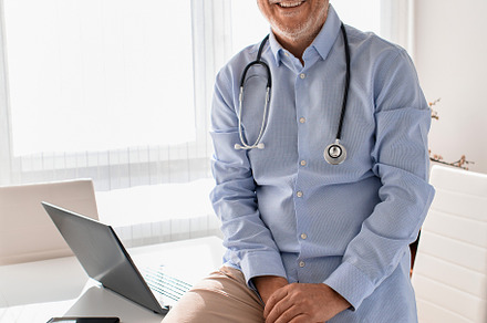 Portrait of mature doctor smiling an