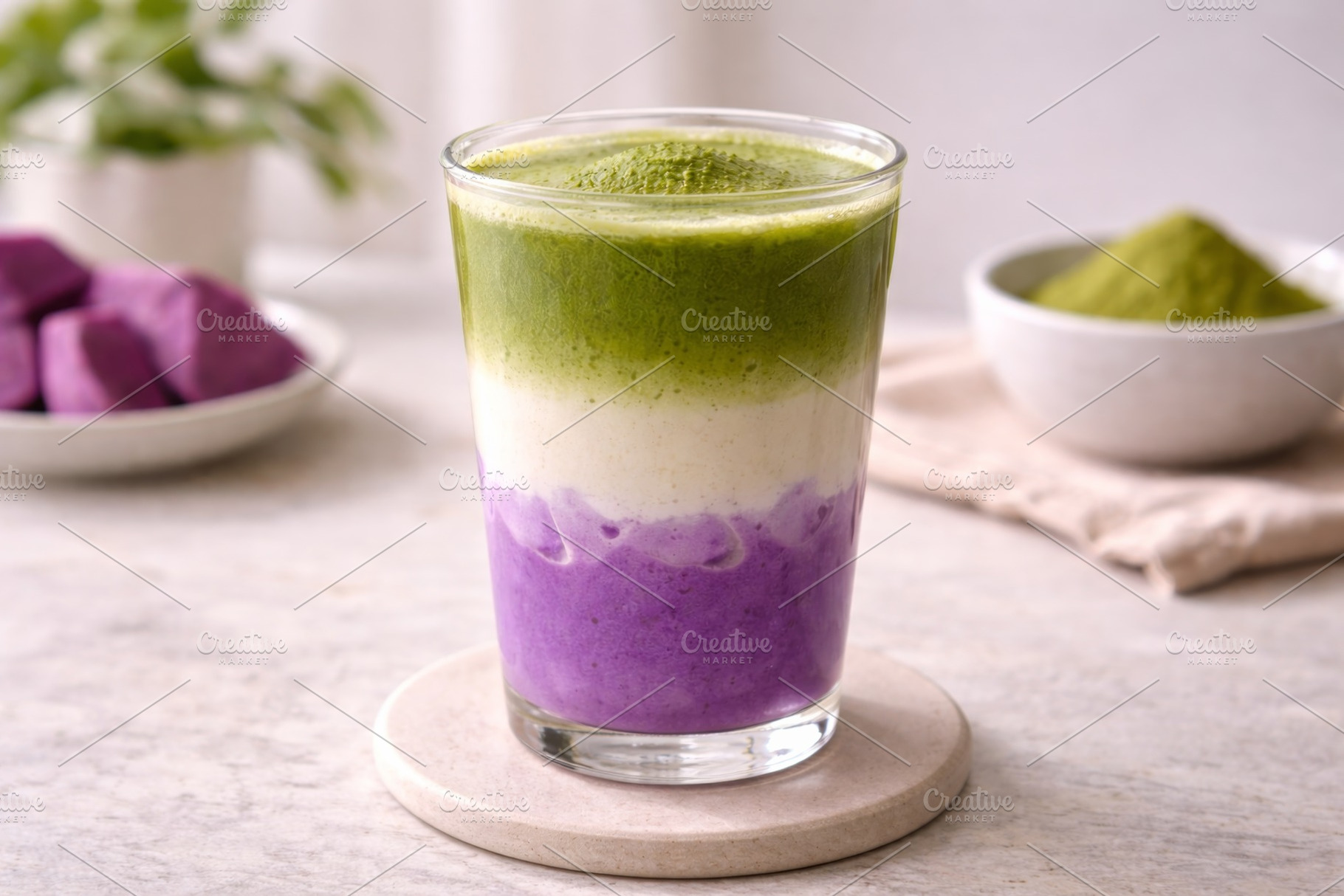 Ube matcha layered drink in glass on, a Photo by Dvoevnore photos