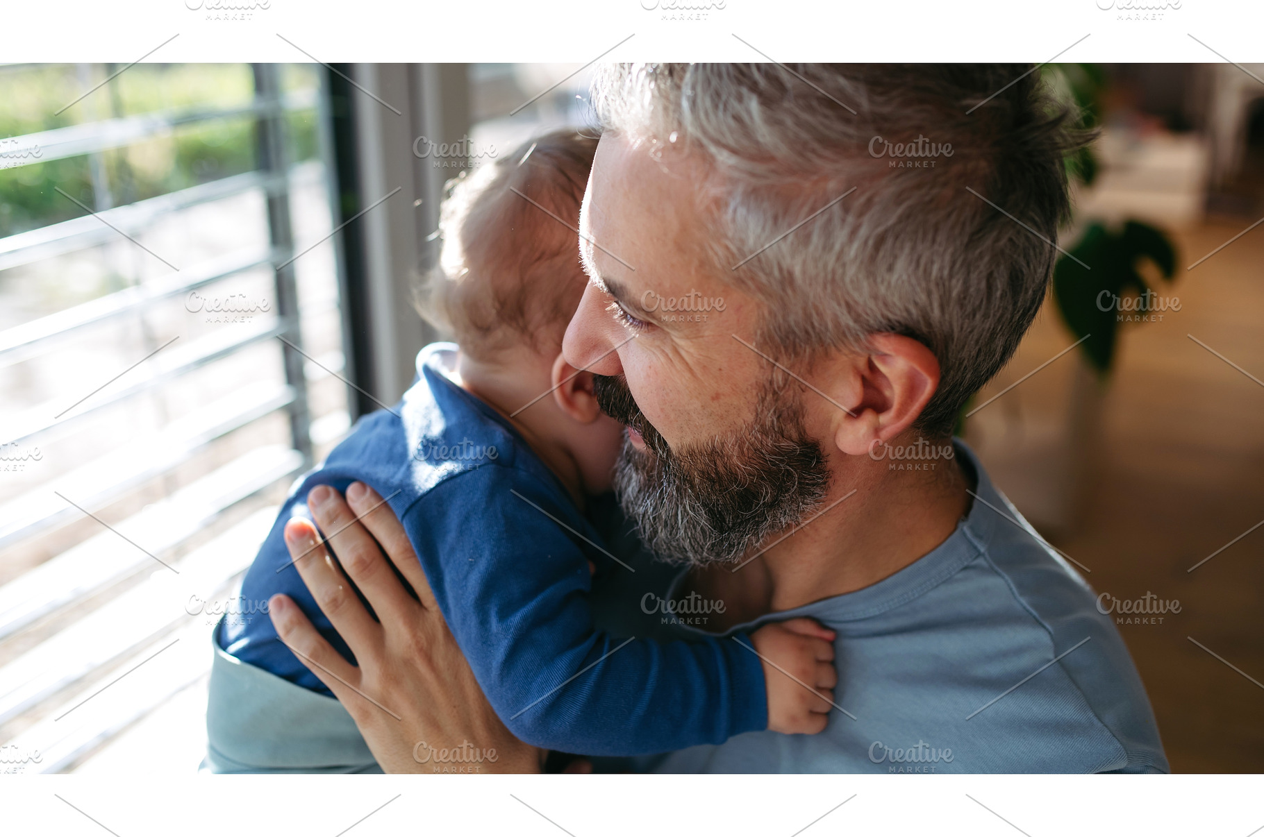Father with little toddler son at, a Person Photo by HalfPoint