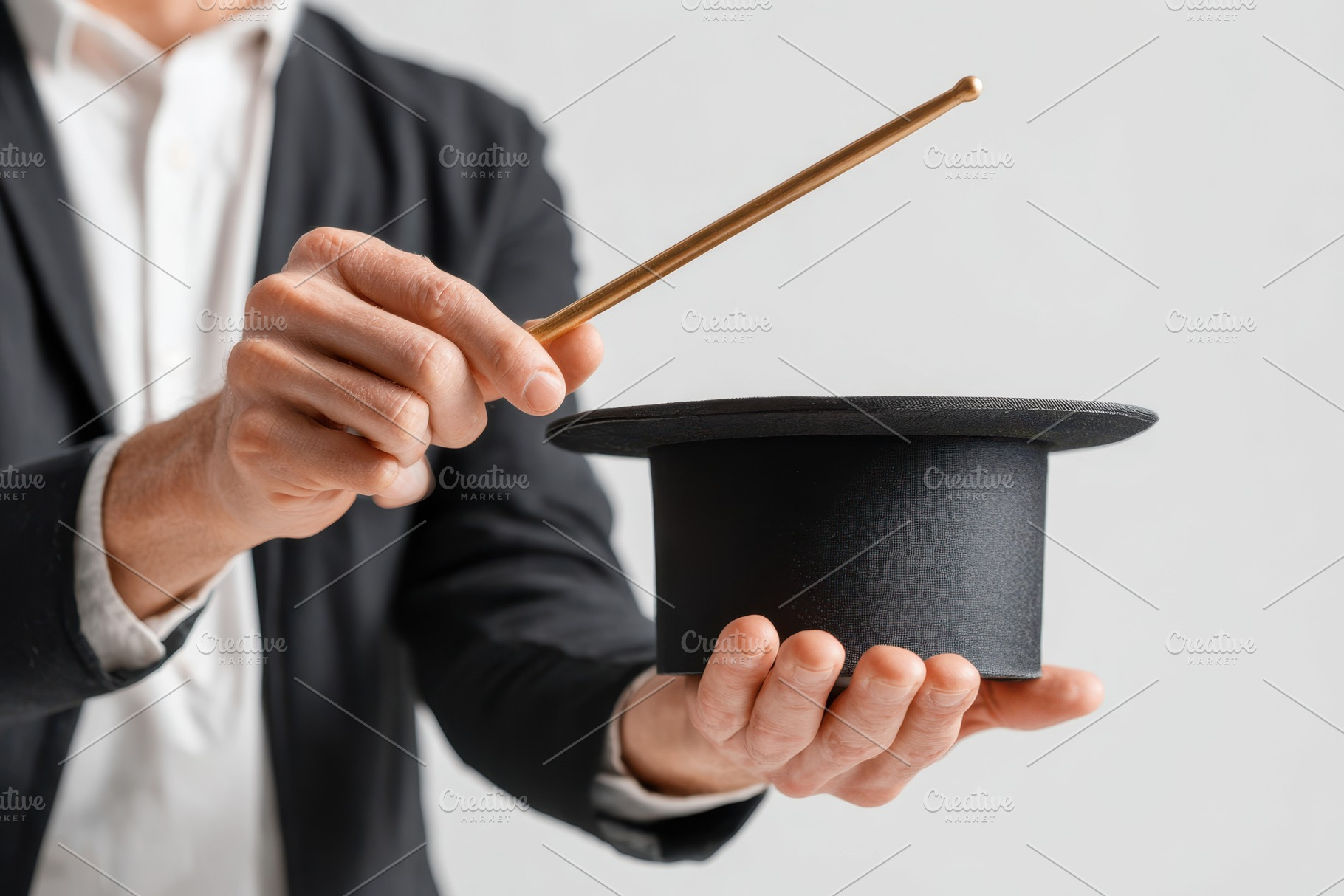 Magician holding black top hat and wand, an Arts & Entertainment Photo by AlyaAnd