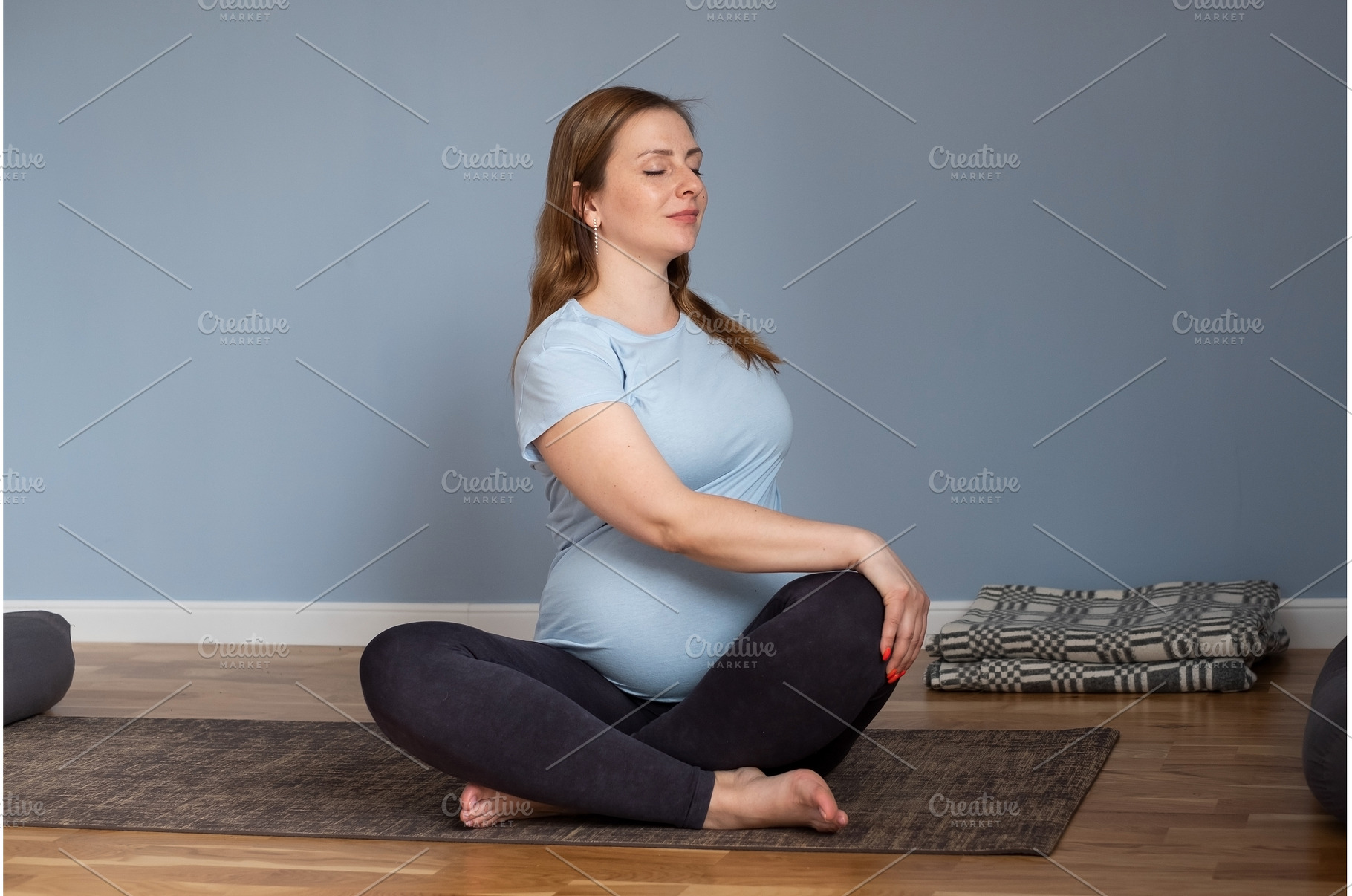 Pregnant caucasian woman sitting on, a Sports & Recreation Photo by Koldunov