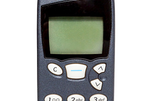 Old vintage mobile phone isolated, a Technology Photo by BOOCYS