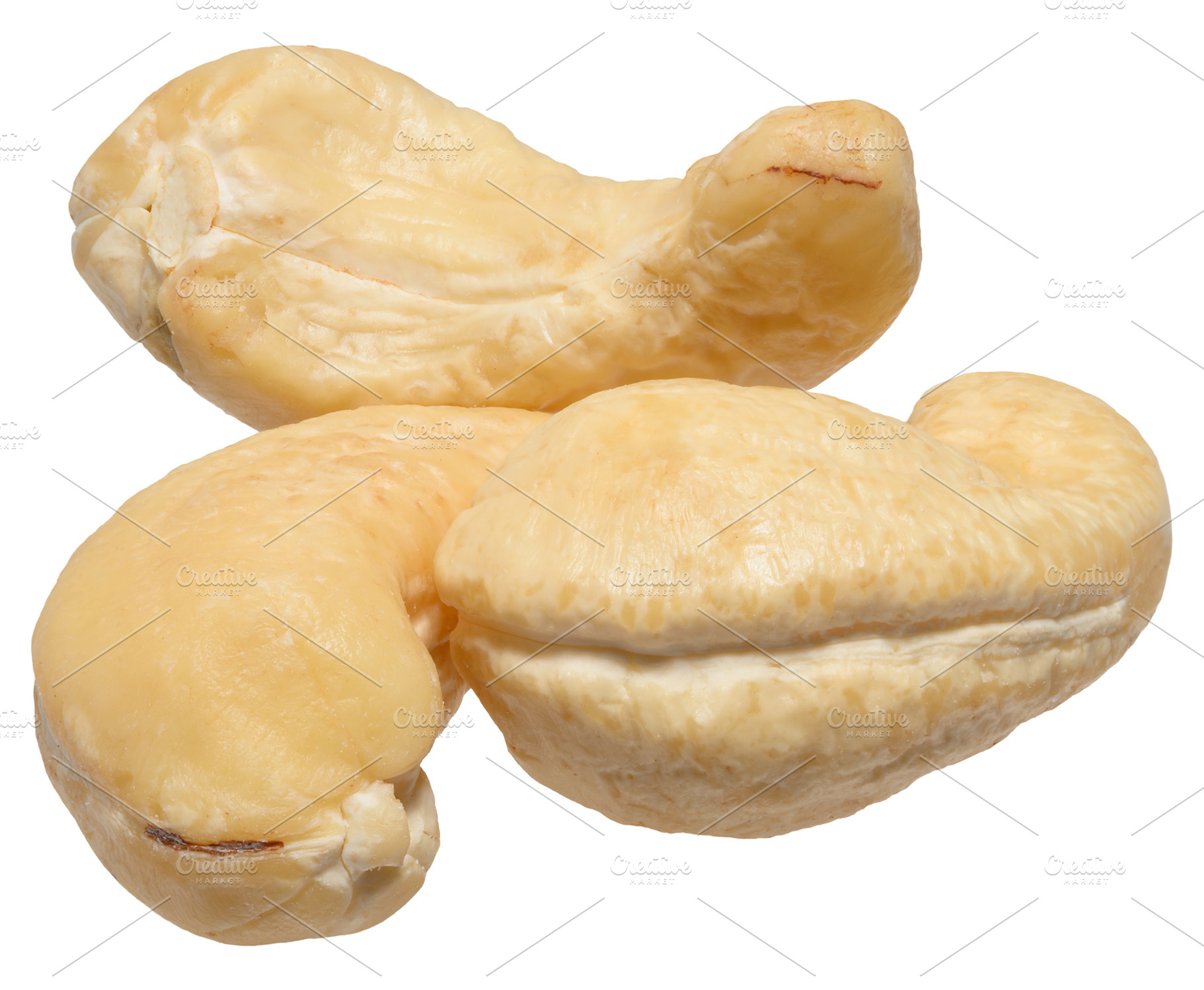 Heap of peeled cashew nuts on isolated background, a Food & Drink Photo by ndanko