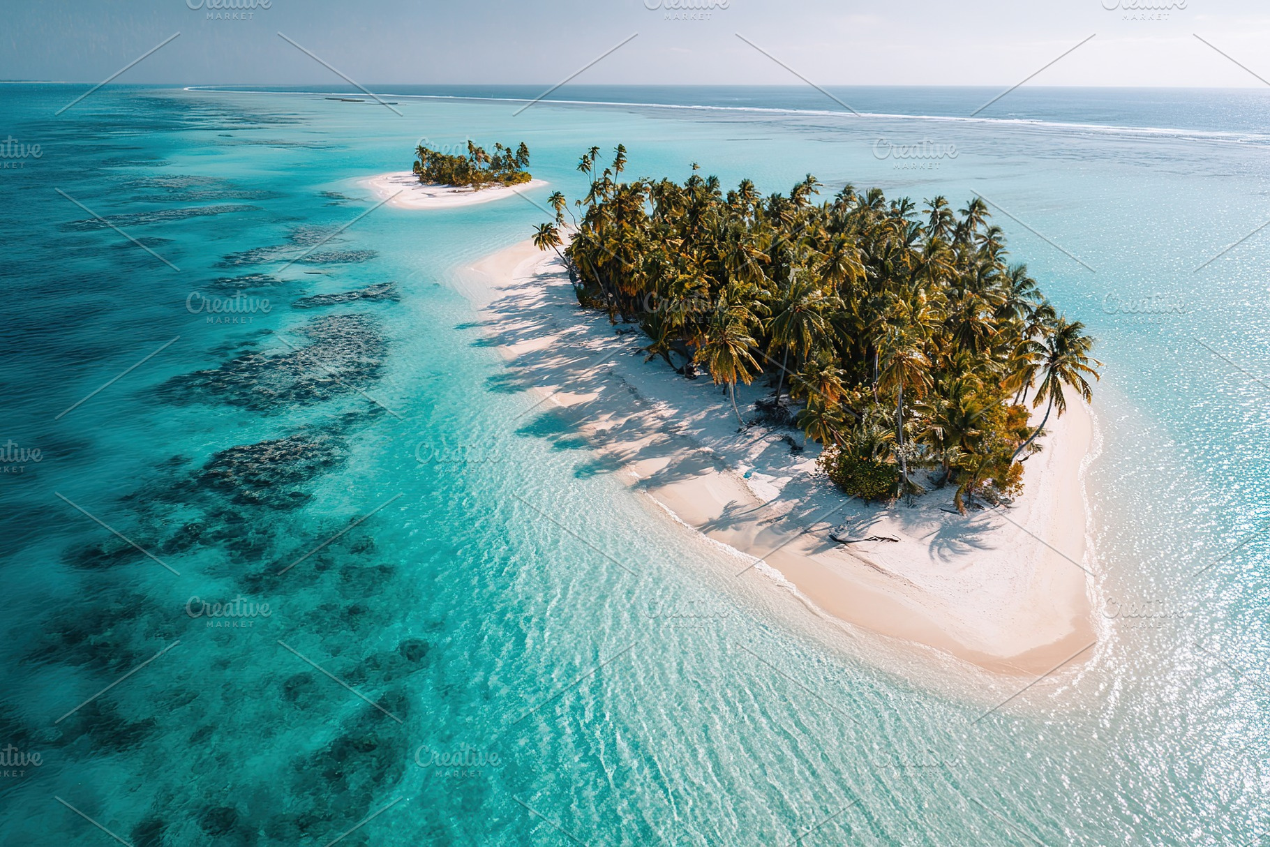 Picturesque island paradise with palm trees and clear turquoise waters in a tro, a Photo by AlyaAnd