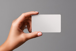 Hand with card on gray bg, a Photo by Beautiful things
