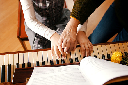 A little girl playing piano on music, a School & Education Photo by Barcelona_dreams