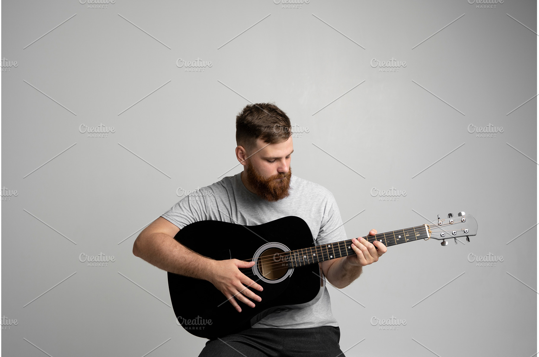 Bearded guitarist man with a black, a Person Photo by volodymyrshtun13795