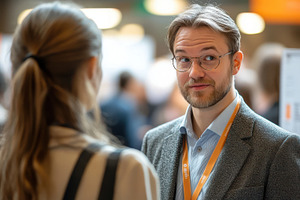 Young man in glasses talks with a wo, a Photo by Pixeness Studio
