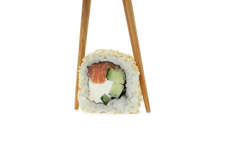 Chopsticks with roll isolated on white background, a Food & Drink Photo by AtlasStudio PRO