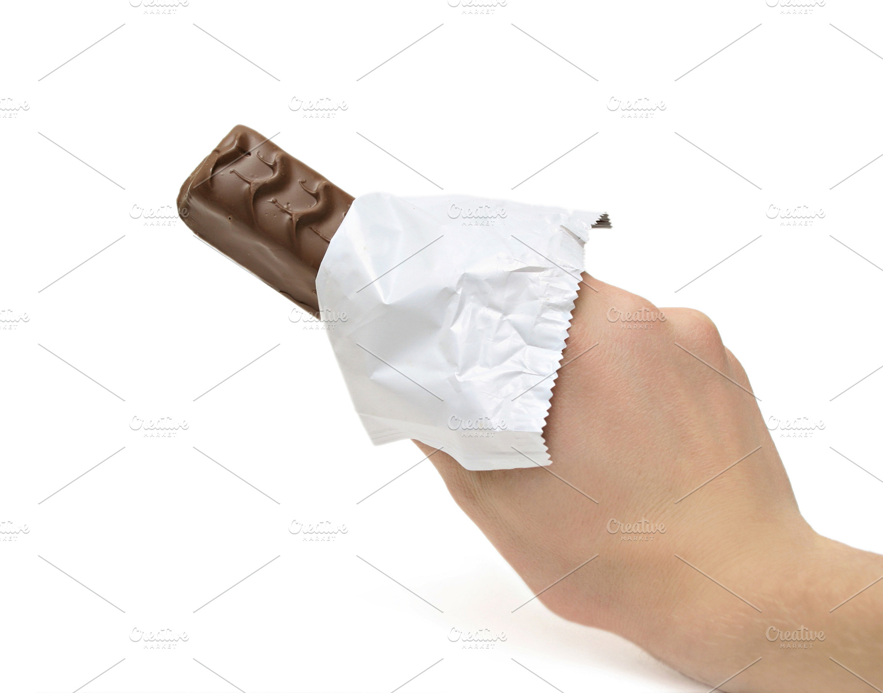 Chocolate bar in the hand, a Photo by saiko3p