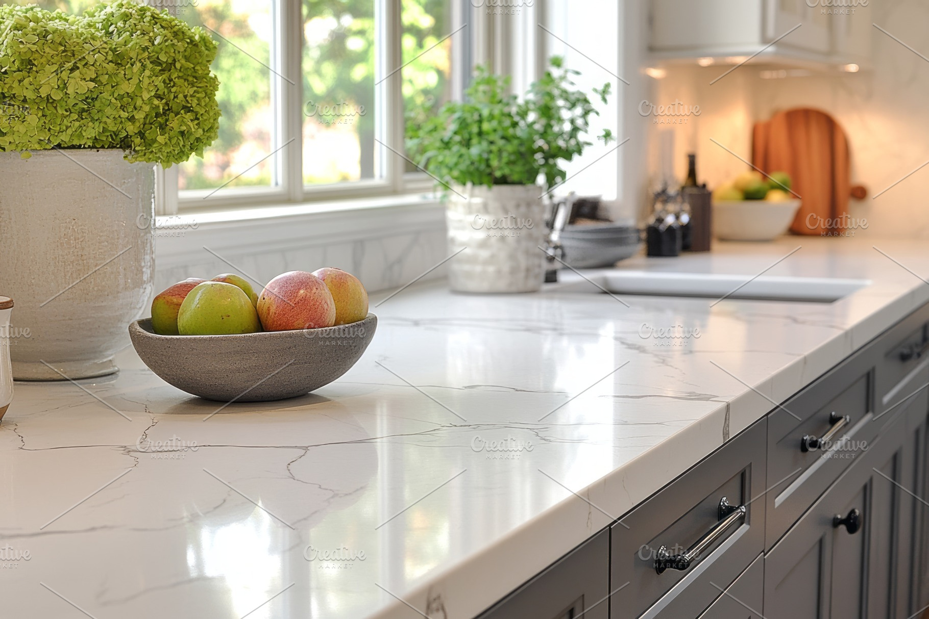 A serene kitchen scene featuring a bowl of apples on a marble countertop with p, a Background Photo by ImageMir