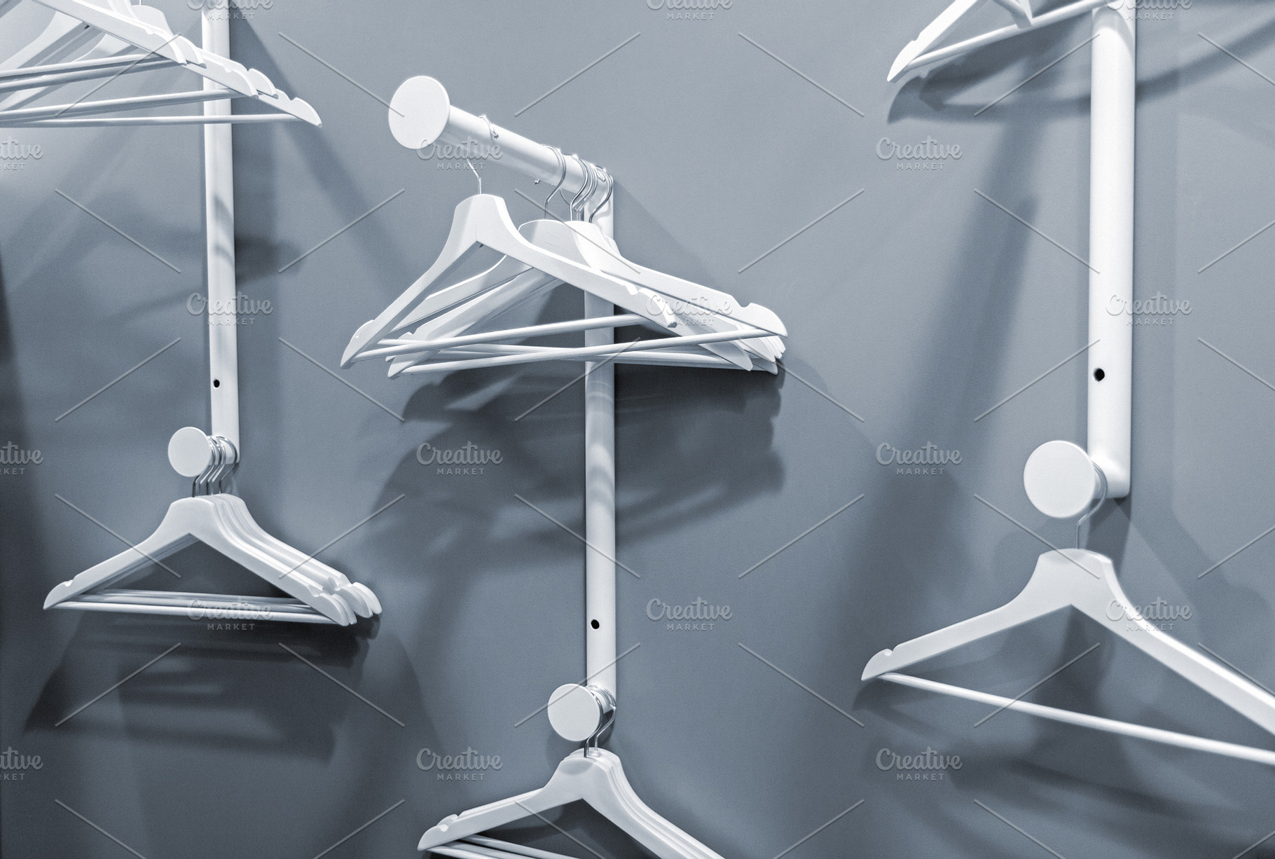 Empty hangers on a clothes rack, a Beauty & Fashion Photo by BOOCYS