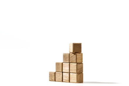 Wood cubes stacked as stair step shapes on white, a Business Photo by 1981 Rustic studio kan