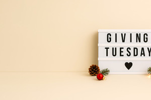 Giving tuesday sign with christmas d, a Photo by Dvoevnore photos