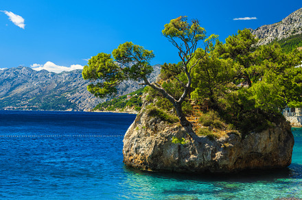 Small rock island in the sea, Brela, a Nature Photo by Alpine Dreams