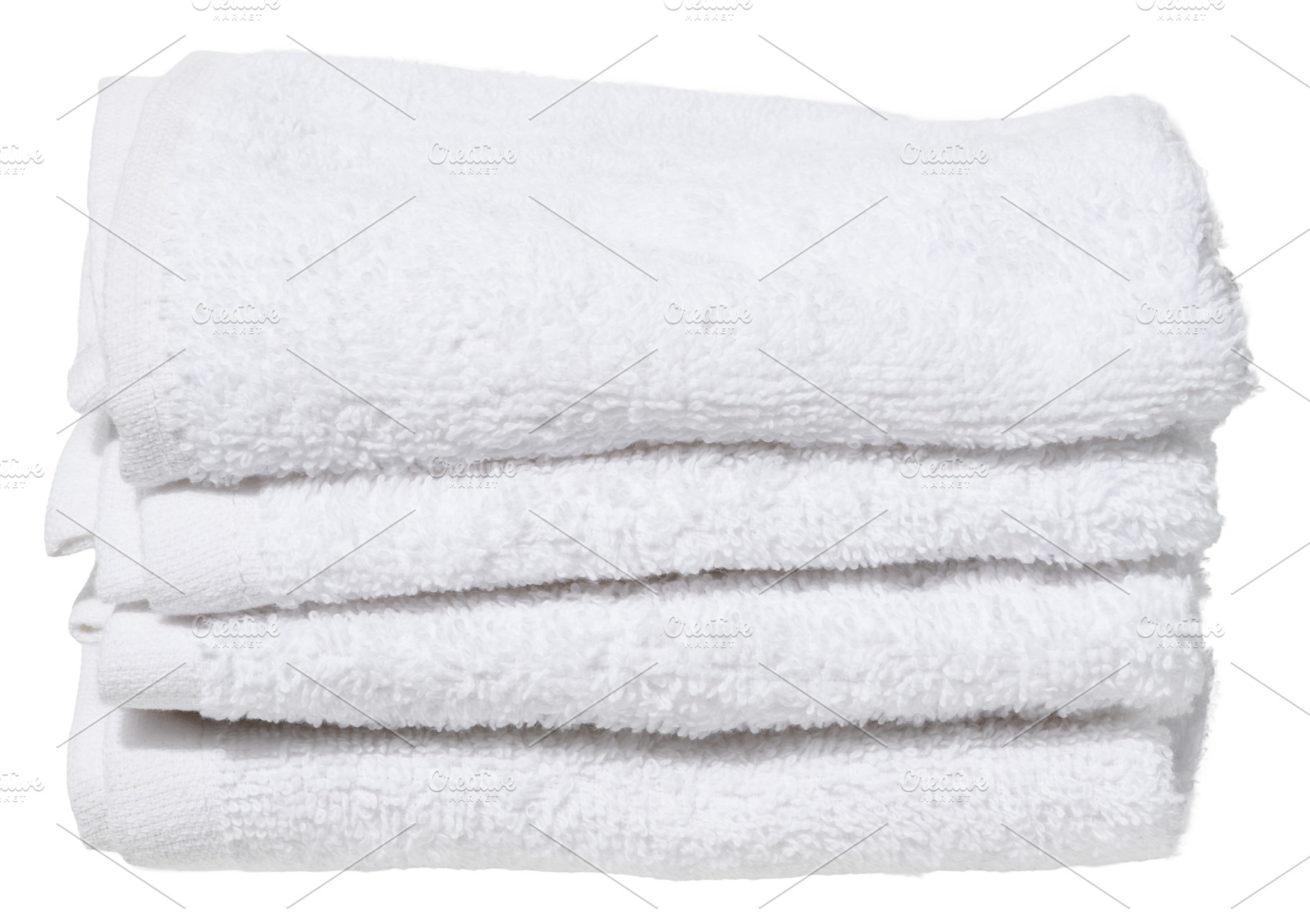 Stack of four folded white terry towels, on isolated background., an Abstract Photo by ndanko