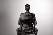 Person sitting alone on a chair with in an empty room at backgro, a Health & Medical Photo by DanFLCreativo (Thumbnail 1 of 2)