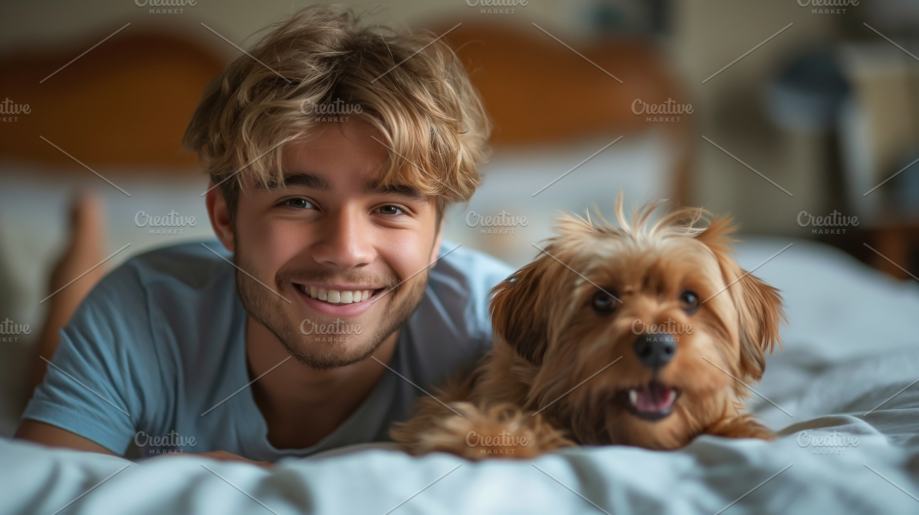 A smiling young Caucasian man relaxing on a bed with his playful dog, creating, a Person Photo by ImageMir