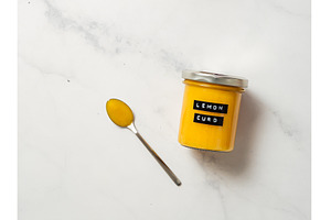 Homemade lemon curd in jar, top view, a Food & Drink Photo by Fascinadora